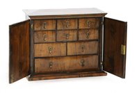 Lot 514 - A William and Mary walnut spice cabinet
