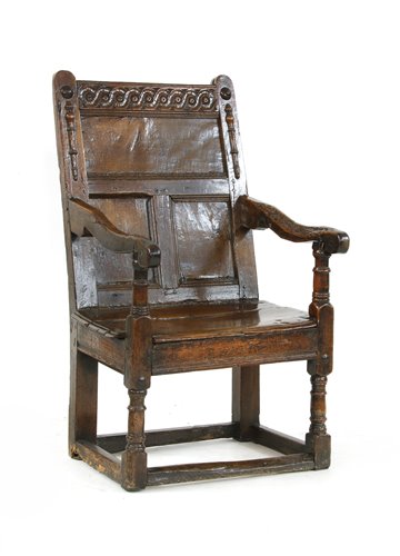 Lot 535 - An oak panel back open armchair