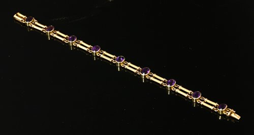 Lot 98 - An Edwardian gold amethyst bracelet