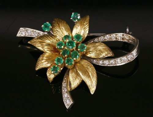 Lot 234 - An 18ct two colour gold emerald and diamond brooch