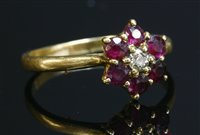 Lot 76 - An 18ct gold, diamond and ruby cluster ring