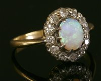 Lot 281 - A gold opal and diamond cluster ring