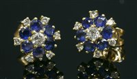 Lot 503 - A pair of 18ct gold diamond and sapphire cluster earrings