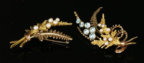 Lot 233 - A 9ct two colour gold blue zircon and cultured pearl fern spray brooch