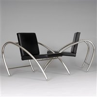 Lot 555 - A pair of chrome lounge chairs