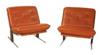 Lot 557 - A pair of leather lounge chairs
