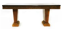 Lot 638 - An Art Deco walnut and faux rosewood dining table