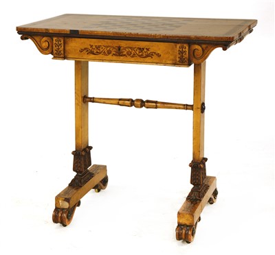 Lot 651 - A Regency burr maple games table