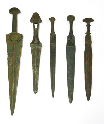 Lot 506 - Five bronze daggers