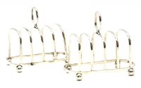 Lot 367 - A pair of 20th century silver toast racks