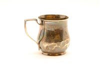 Lot 374 - A Georgian silver christening mug