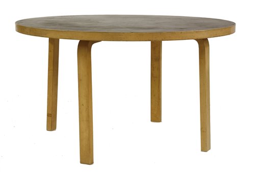 Lot 518 - A birch laminated circular table