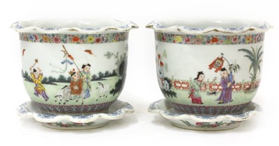 Lot 99 - A pair of Chinese famille rose jardinières and stands