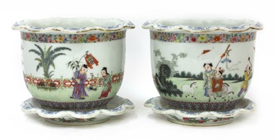 Lot 99 - A pair of Chinese famille rose jardinières and stands