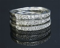 Lot 668 - A 9ct white gold five row diamond band ring