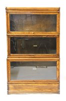 Lot 720 - Three section oak Globe Wernicke stepped bookcase