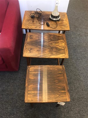 Lot 261 - A nest of three rosewood side tables