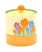 Lot 395 - A Clarice Cliff 'Crocus' preserve pot and cover