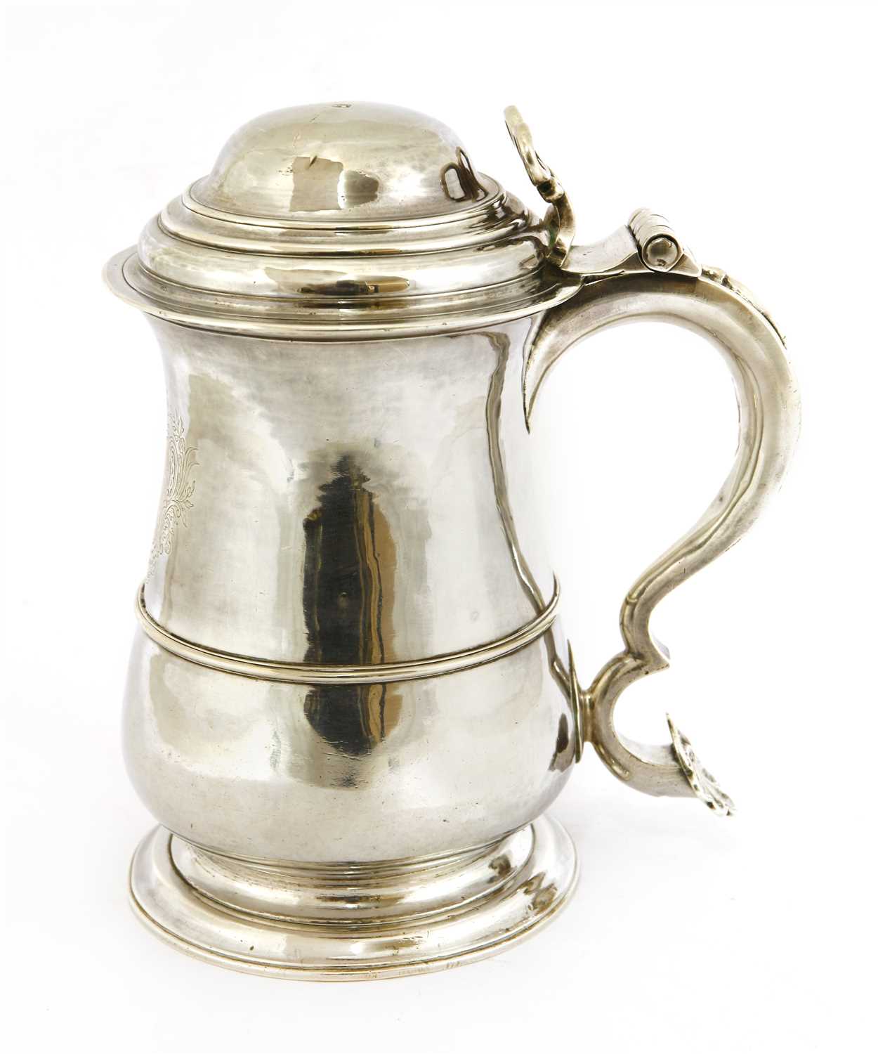 Lot 83 - A George II provincial baluster shape tankard and cover