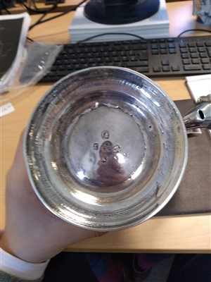 Lot 83 - A George II provincial baluster shape tankard and cover