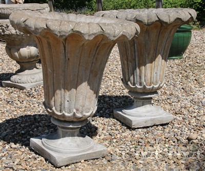 Lot 469 - A pair of tall tapering composite stone planters