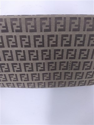 Lot 765 - A Fendi beige and brown monogram canvas baguette handbag