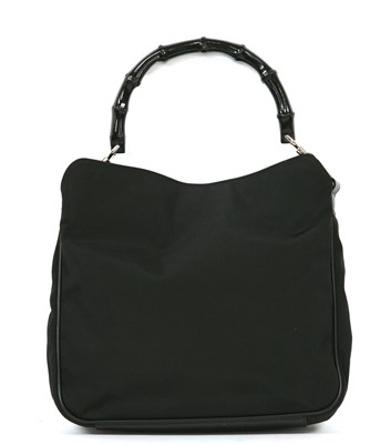 Lot 789 - A Gucci black canvas bamboo handbag