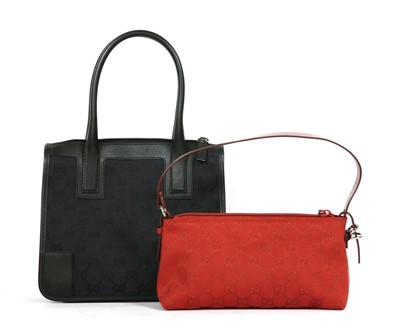 Lot 792 - A Gucci red monogram canvas shoulder handbag