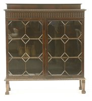 Lot 242 - A mahogany and glazed display cabinet