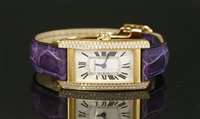 Lot 411 - A ladies 18ct gold Cartier Tank Americaine quartz strap watch