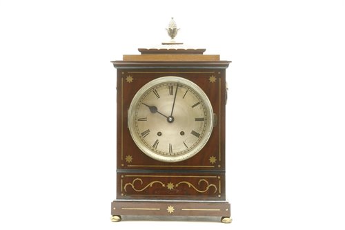 Lot 542 - A Regency style Rosewood and brass 'inlaid' bracket clock