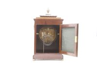 Lot 542 - A Regency style Rosewood and brass 'inlaid' bracket clock