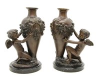 Lot 578 - A pair of early 20th century French bronze cherub and vase