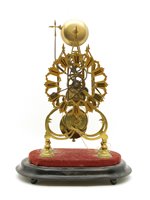 Lot 594 - A 19th century brass skeleton clock