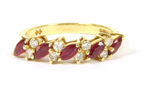 Lot 214 - A ruby and diamond half hoop ring