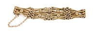 Lot 194 - A gold four row crossover gate link bracelet
