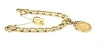 Lot 259 - A 9ct gold curb link bracelet with padlock