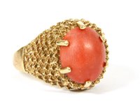 Lot 165 - A 9ct gold single stone oval coral cabochon ring