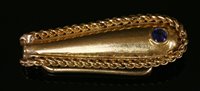 Lot 241 - An 18ct gold single stone sapphire money clip