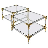 Lot 252 - A pair of Lucite and brass side tables