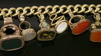 Lot 13 - An 18ct gold curb link bracelet with later 9ct gold padlock and eleven assorted seals