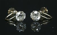 Lot 57 - A pair of single stone diamond stud earrings