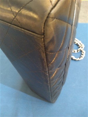 Lot 742 - A Chanel classic single flap black leather maxi handbag
