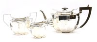 Lot 381 - A George V silver three piece teaset