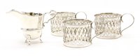 Lot 363 - A set of three silver cup holders