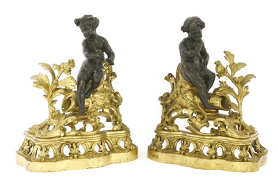 Lot 591 - A pair of French bronze and gilt metal chenet
