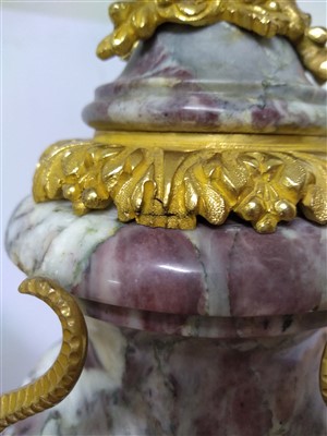 Lot 554 - A pair of rouge marble and ormolu-mounted urns