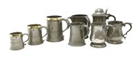 Lot 260 - A graduated set of three George III pewter mugs
