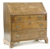 Lot 696 - A Georgian oak bureau