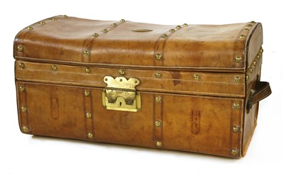 Lot 580 - A leather and brass-studded trunk